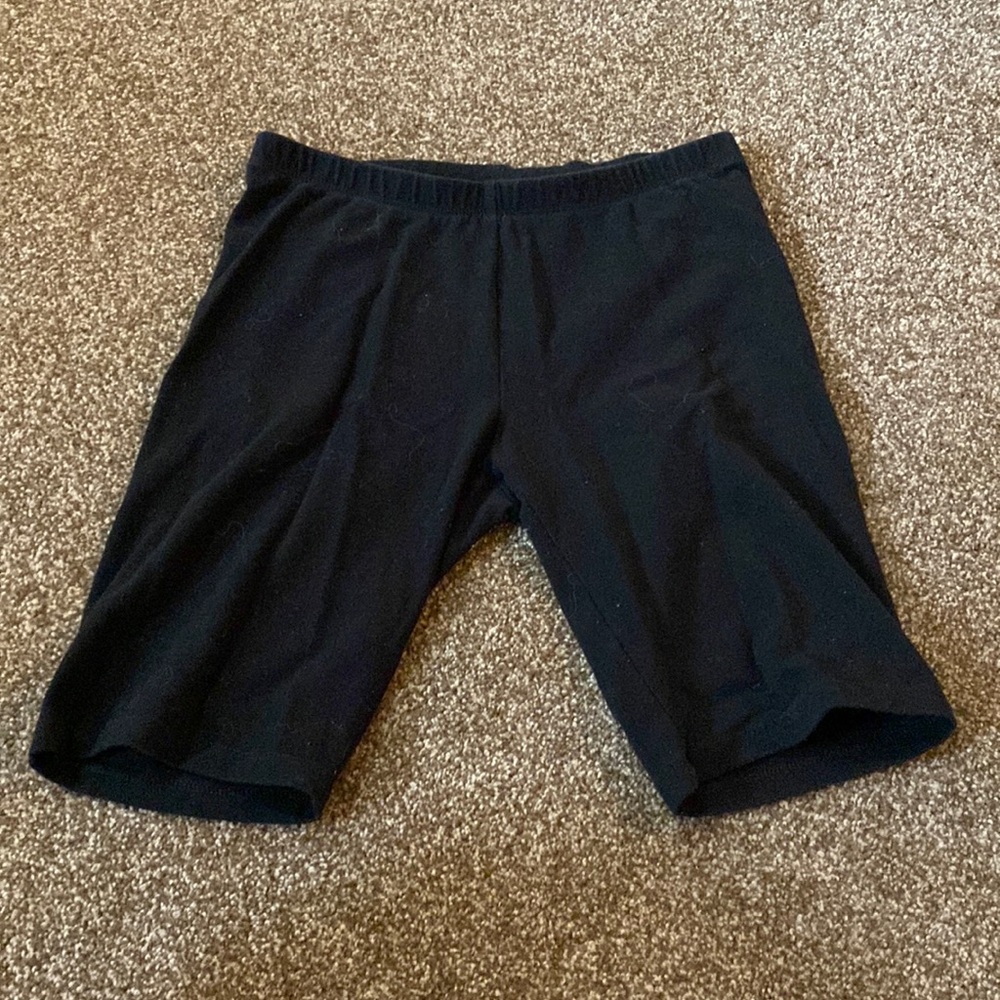 They are longer shorts, Brand is Cat and Jack, and it is black.